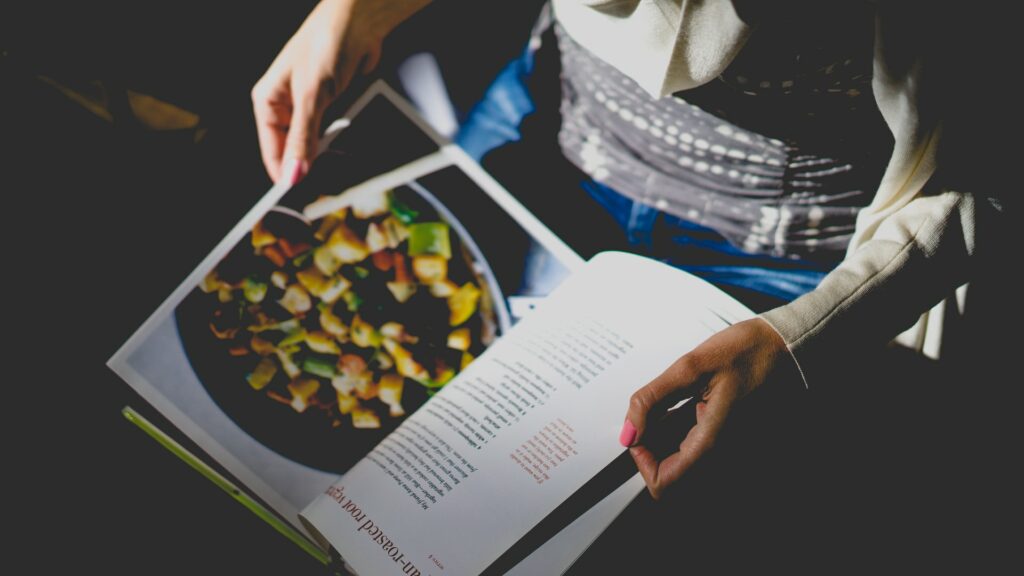 Woman reading cookbook