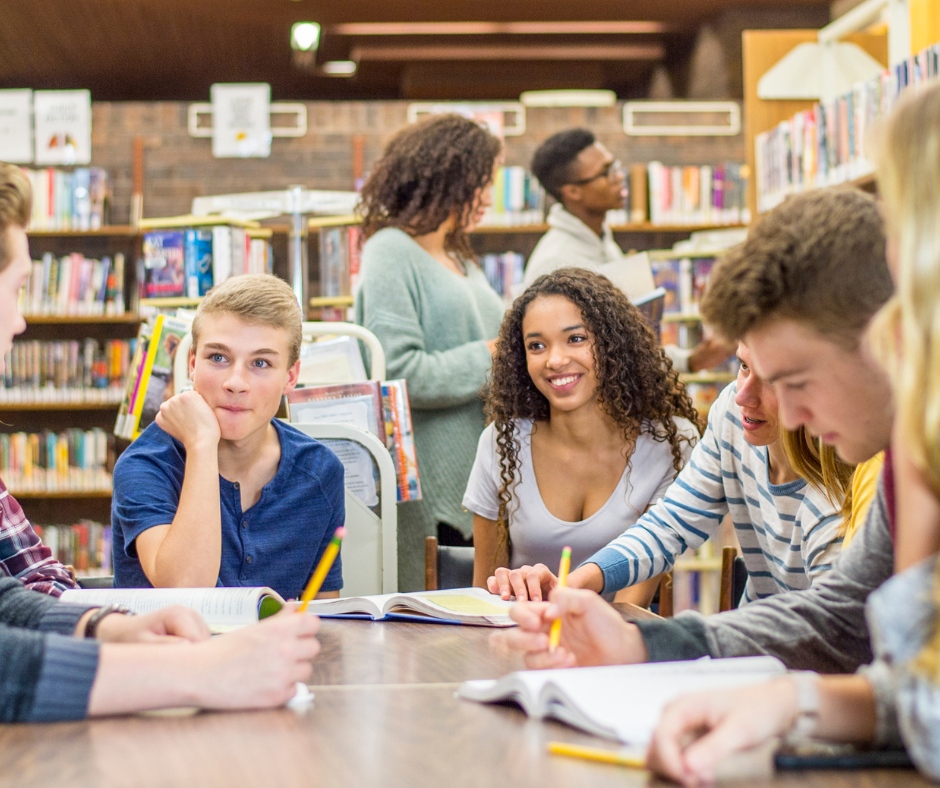 Young people working in a library.